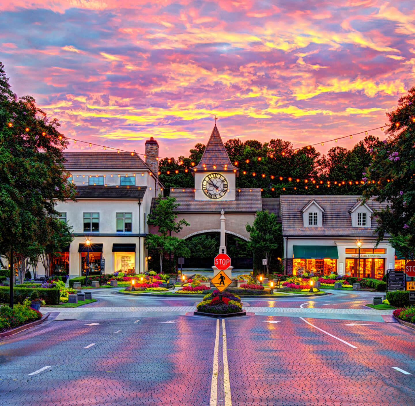 front view of clock tower at The Forum Peachtree Corners during sunset