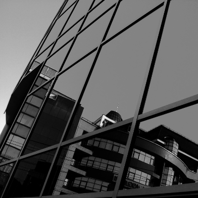 Modern glass building reflection in black & white