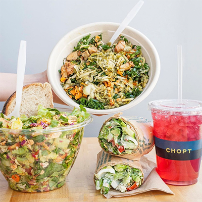 Chopt salad bowl, two salad wraps, and a red drink