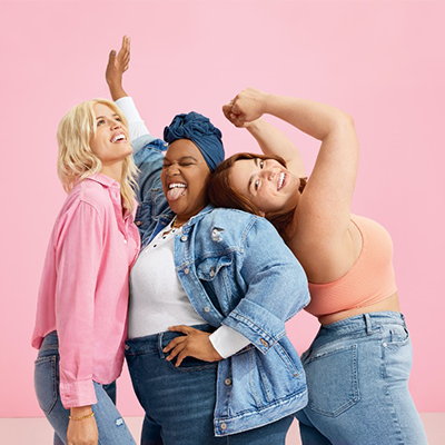 "three women of diverse sizes expressing happiness. "